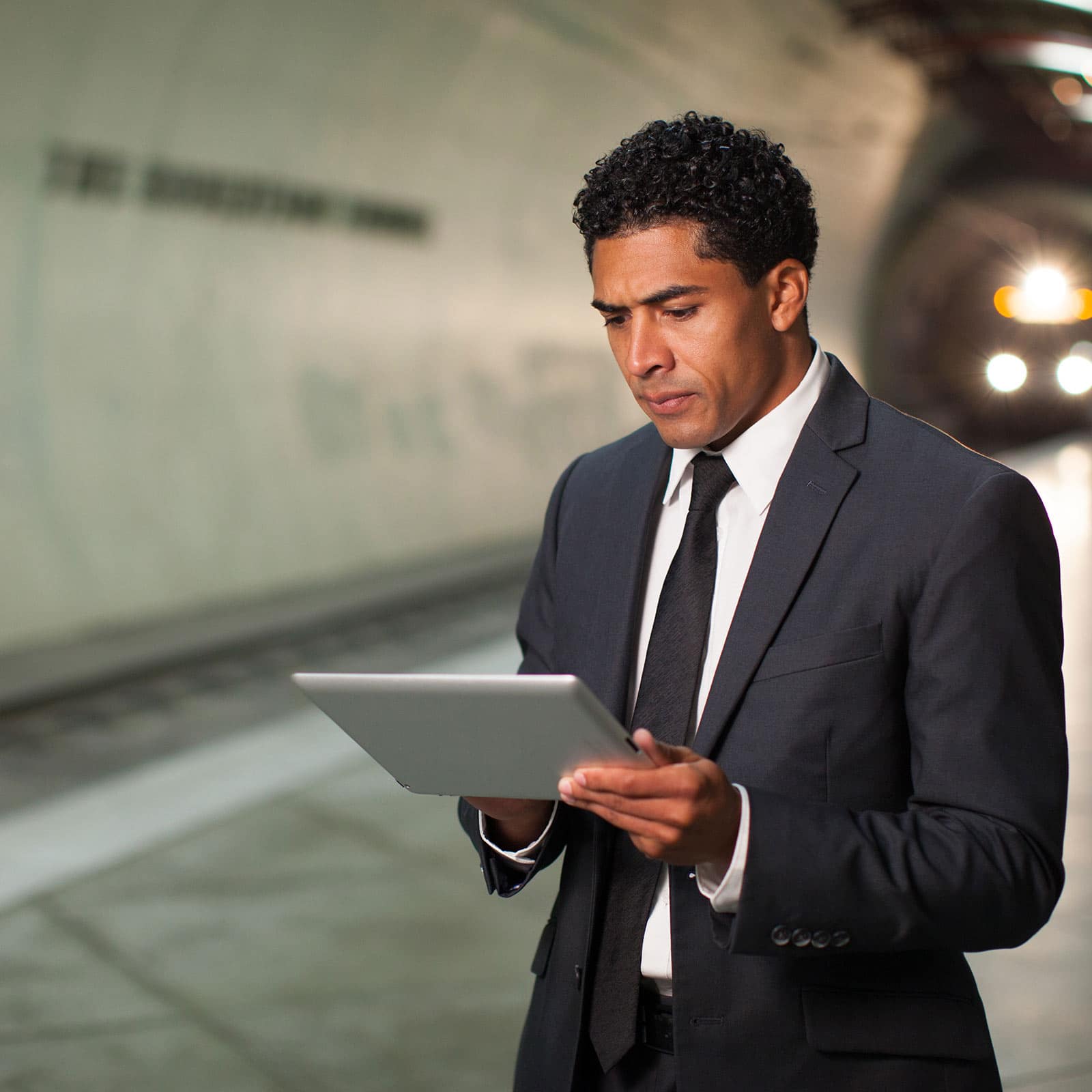 Man works on Tablet