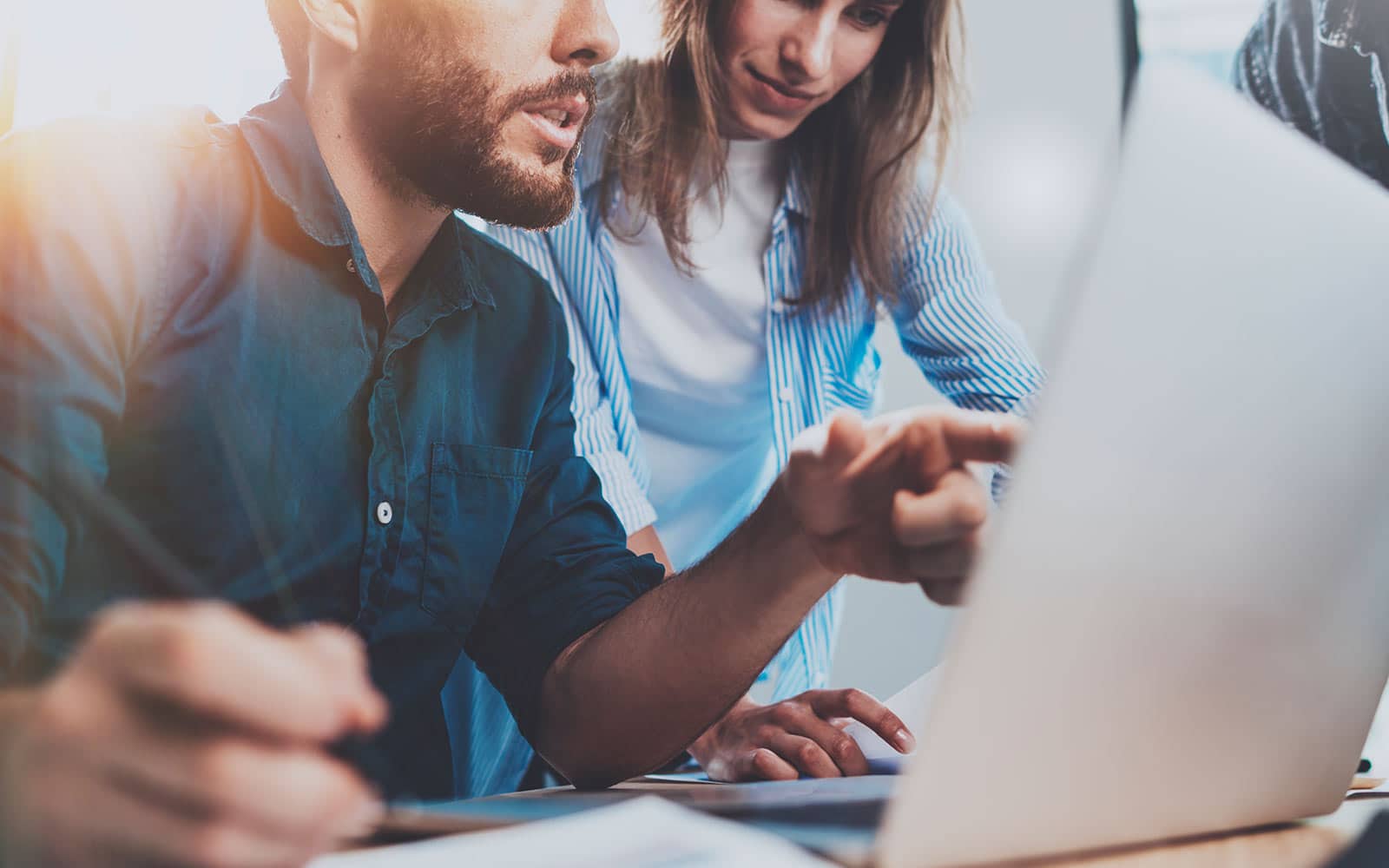 Man and Woman working on Laptop